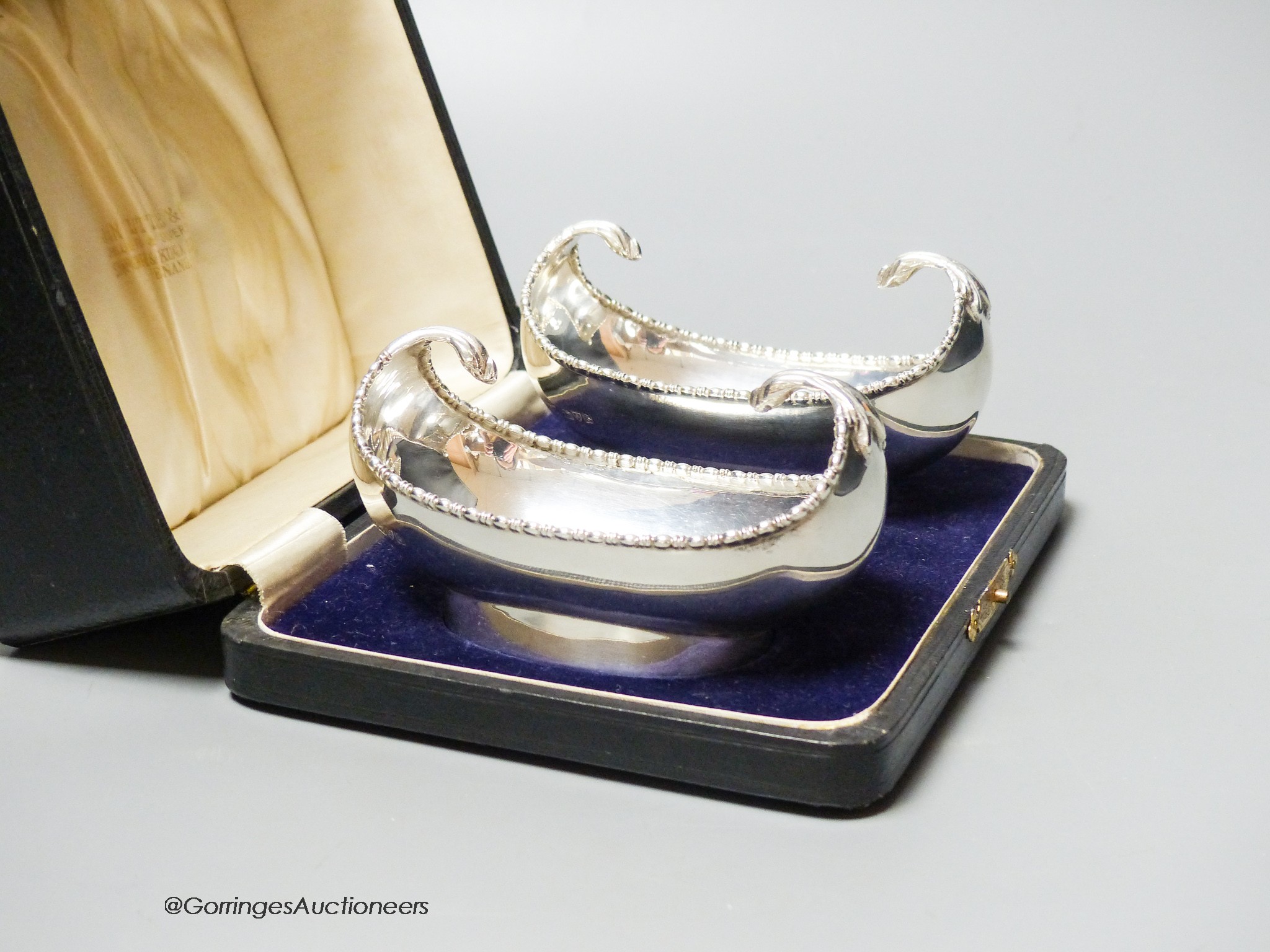 A cased pair of George V silver boat shaped bonbon dishes, S. Blanckensee & Son Ltd, Chester, 1927, 11.3cm, 6oz.